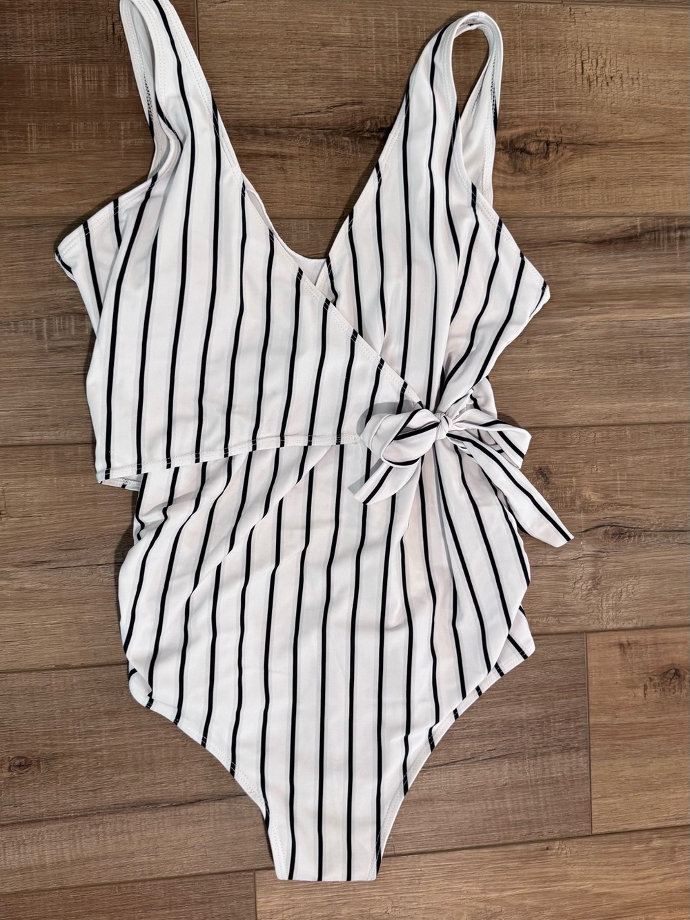 White One-Piece Swimsuit with Black Vertical Stripes and Side Tie